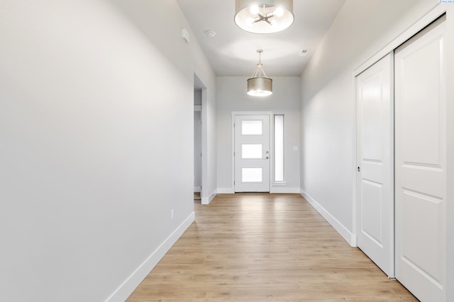 6531 W 30th Pl, Kennewick, WA 99338 - doorway featuring baseboards and light wood-style floors
