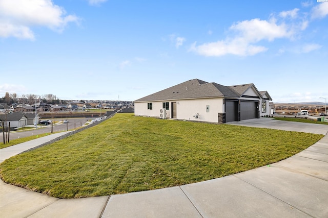 6531 W 30th Pl, Kennewick, WA 99338 - view of property exterior featuring driveway, an attached garage, and stucco siding