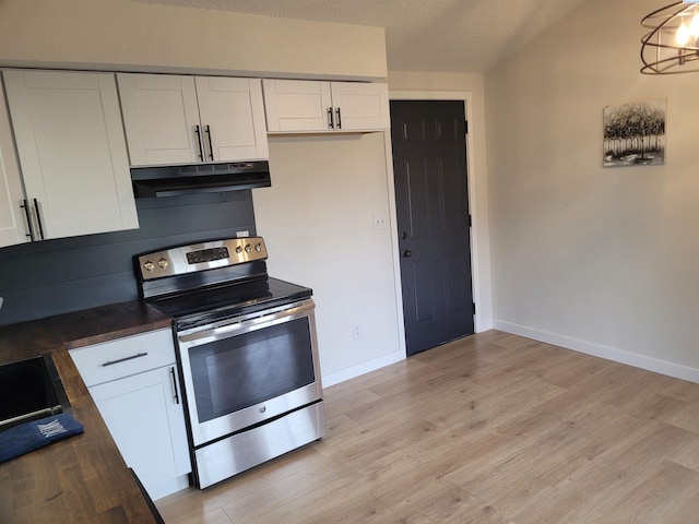 kitchen with white cabinetry, a textured ceiling, stainless steel range with electric cooktop, and light hardwood / wood-style floors