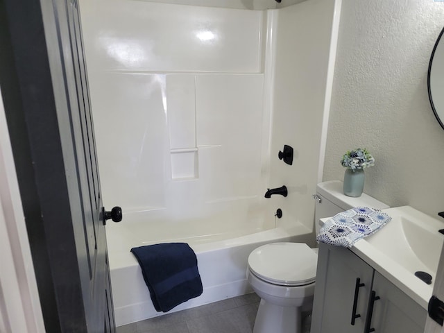 full bathroom featuring vanity, tub / shower combination, tile patterned floors, and toilet