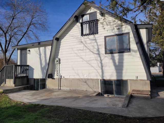 back of property featuring a patio area