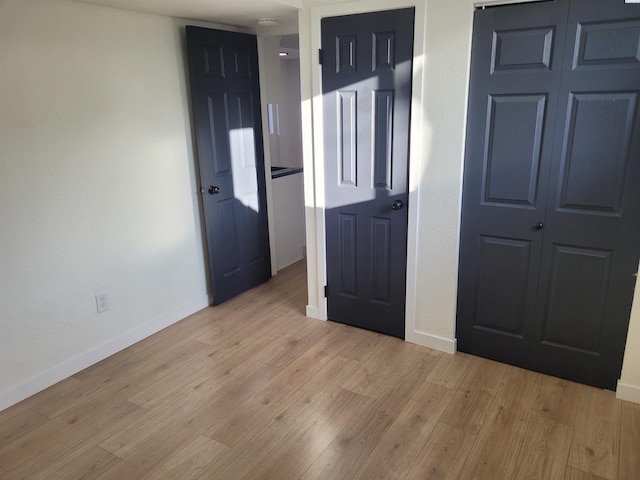 unfurnished bedroom featuring light hardwood / wood-style flooring