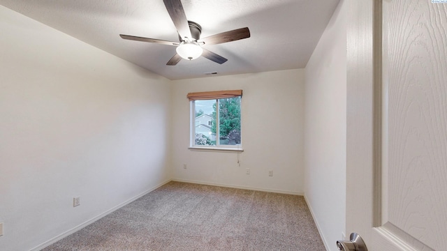 1625 NW Valhalla Dr, Pullman, WA 99163 - unfurnished room with light carpet, a ceiling fan, and baseboards