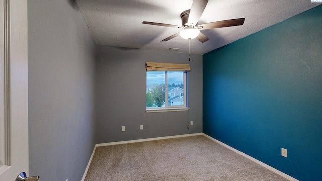 1625 NW Valhalla Dr, Pullman, WA 99163 - spare room featuring a ceiling fan, baseboards, carpet, and a textured ceiling