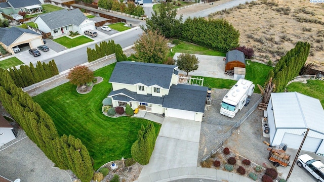 birds eye view of property with a residential view