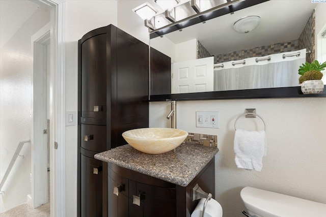 full bath featuring toilet and vanity