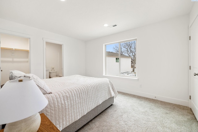 bedroom with visible vents, carpet floors, baseboards, recessed lighting, and ensuite bath