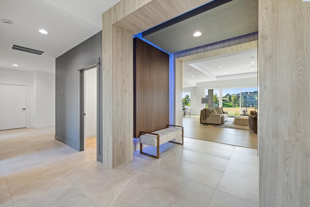 hall with light tile patterned floors