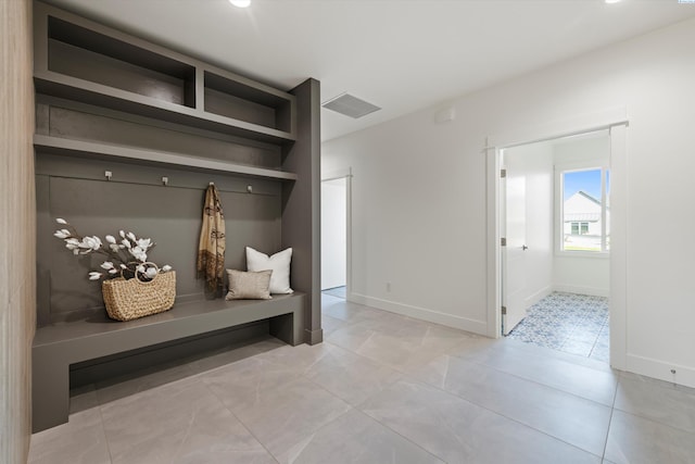 mudroom with light tile patterned floors