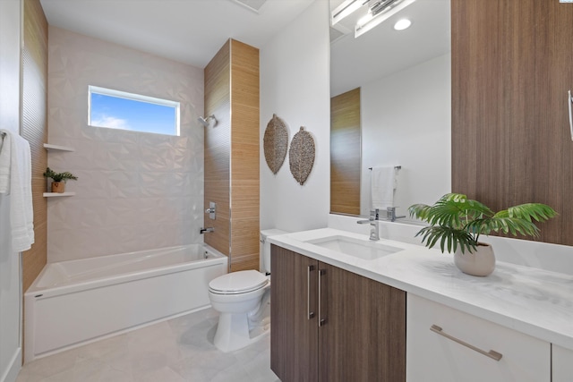 full bathroom featuring tiled shower / bath combo, vanity, and toilet