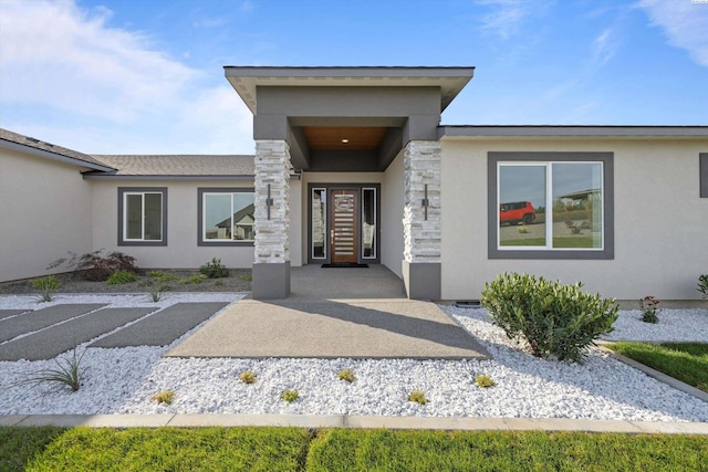 property entrance with a patio area