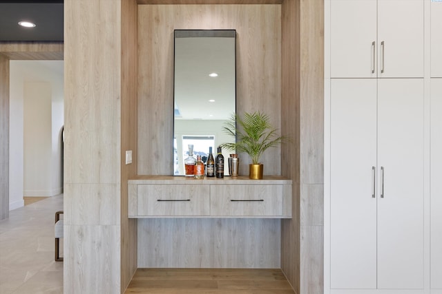 bar with light brown cabinets