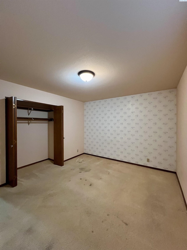 unfurnished bedroom featuring light colored carpet