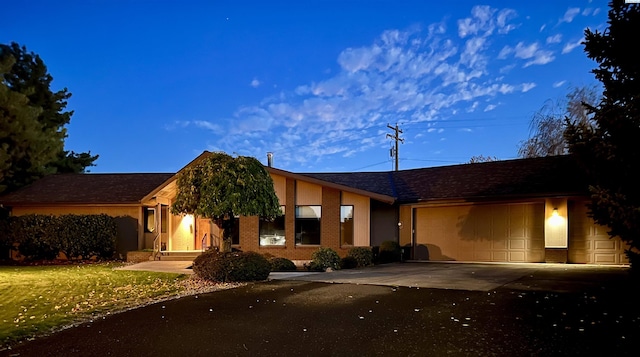 single story home with a garage