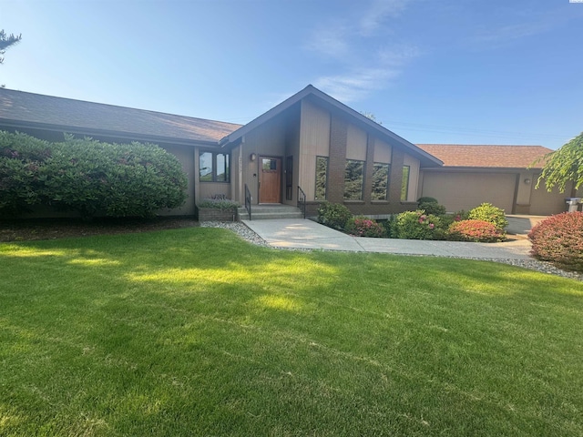 2557 Lancer Pl, Walla Walla, WA 99362 - rear view of property with a lawn and roof with shingles