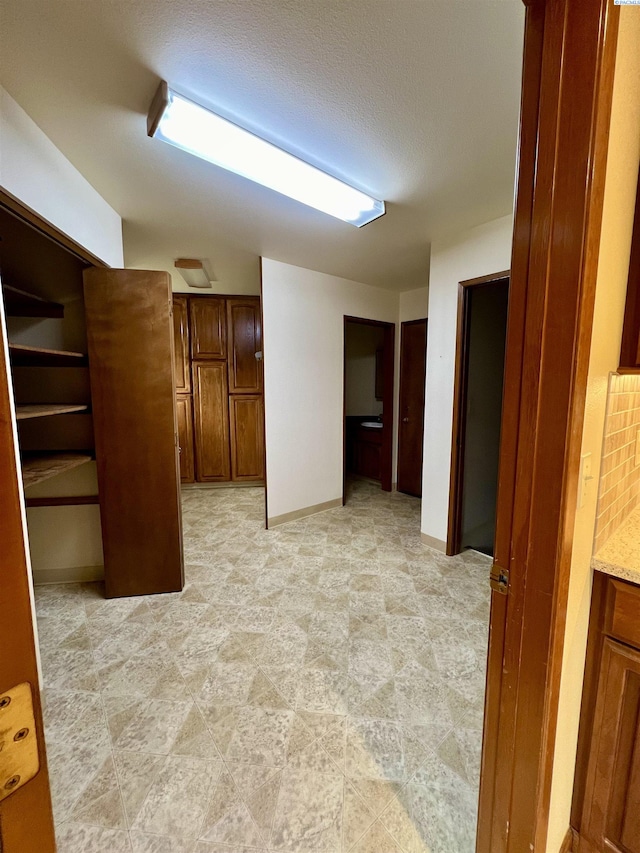 spare room with a textured ceiling