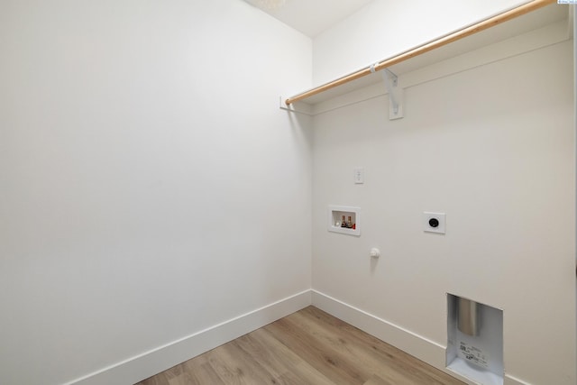 laundry area with laundry area, baseboards, hookup for a washing machine, light wood-style floors, and electric dryer hookup