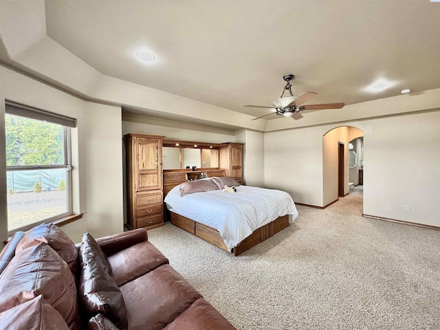 bedroom with light carpet and ceiling fan