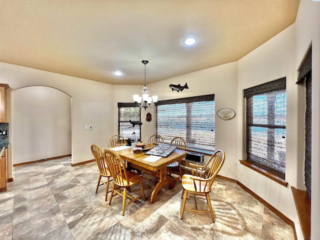 dining space featuring an inviting chandelier