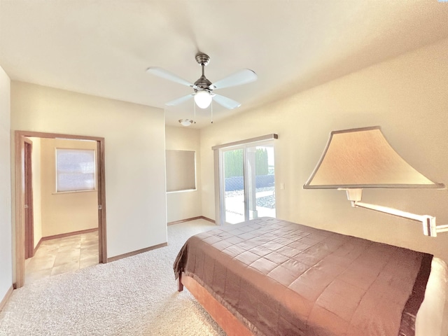 bedroom featuring ceiling fan, light colored carpet, and access to exterior