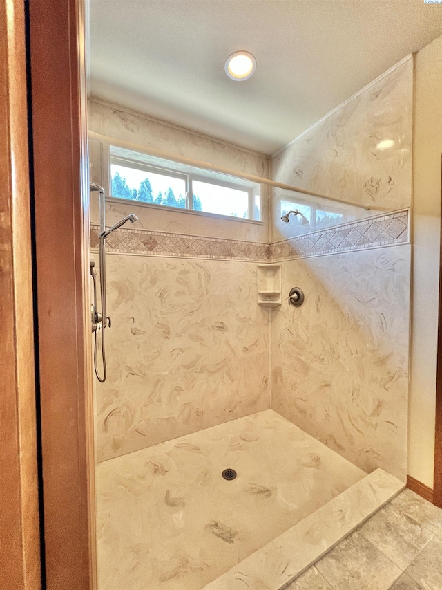 bathroom featuring tiled shower