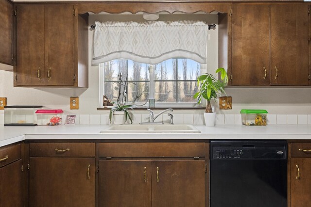 697 Conrad Rd, Touchet, WA 99360 - kitchen featuring dishwasher, a sink, light countertops, and dark brown cabinets