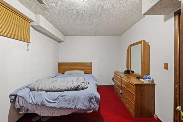 697 Conrad Rd, Touchet, WA 99360 - bedroom featuring carpet flooring and a textured ceiling