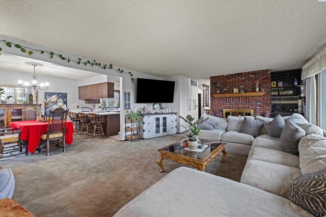 697 Conrad Rd, Touchet, WA 99360 - living room featuring a chandelier, a textured ceiling, carpet, and a fireplace