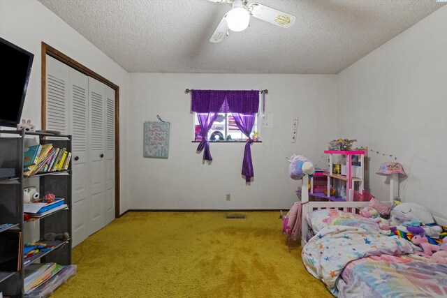 697 Conrad Rd, Touchet, WA 99360 - bedroom with carpet, a textured ceiling, a closet, ceiling fan, and baseboards