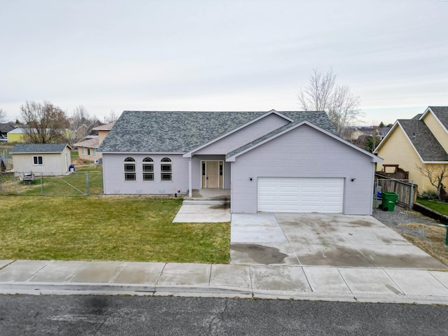 ranch-style house featuring a garage and a front lawn