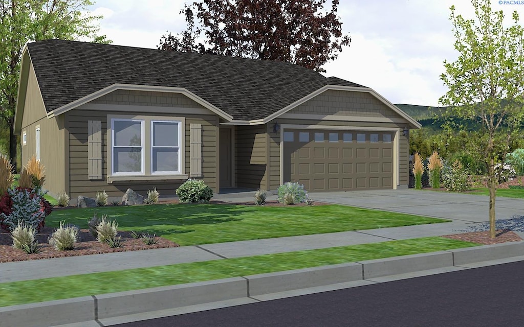 view of front of house featuring a garage and a front lawn