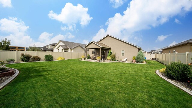 8902 Sophie Rae Ct, Pasco, WA 99301 - rear view of property with a patio area, a fenced backyard, and stucco siding