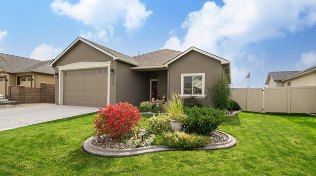 8902 Sophie Rae Ct, Pasco, WA 99301 - ranch-style home with stucco siding, driveway, an attached garage, and roof with shingles