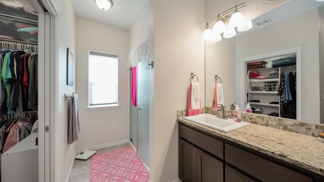 8902 Sophie Rae Ct, Pasco, WA 99301 - full bath with a spacious closet, vanity, and tile patterned flooring