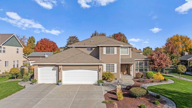 front facade with a garage and a front yard