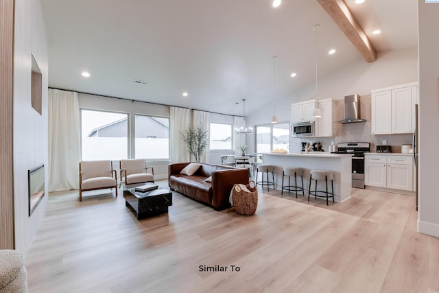 6805 Rd 108, Pasco, WA 99301 - living area featuring a large fireplace, light wood-type flooring, beamed ceiling, recessed lighting, and high vaulted ceiling
