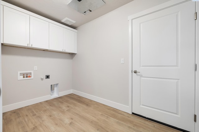 laundry room featuring cabinets, electric dryer hookup, washer hookup, hookup for a gas dryer, and light hardwood / wood-style floors