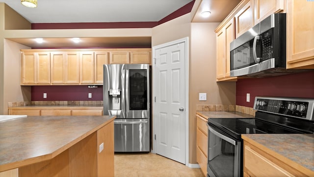 5706 Wrigley Dr, Pasco, WA 99301 - kitchen with stainless steel appliances and light brown cabinets