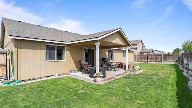 5706 Wrigley Dr, Pasco, WA 99301 - back of property featuring a shingled roof and a patio area