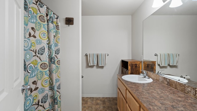 5706 Wrigley Dr, Pasco, WA 99301 - full bath featuring baseboards, vanity, and a shower with shower curtain