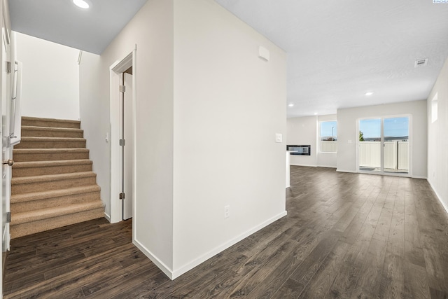 hallway featuring dark wood-type flooring