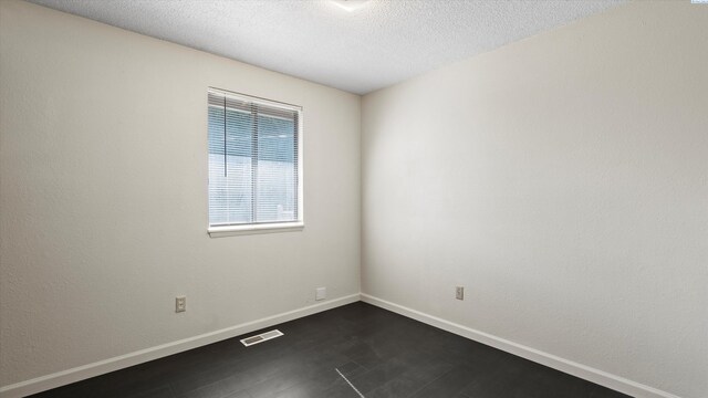 1707 S Fruitland St, Kennewick, WA 99337 - hallway featuring a textured wall and attic access