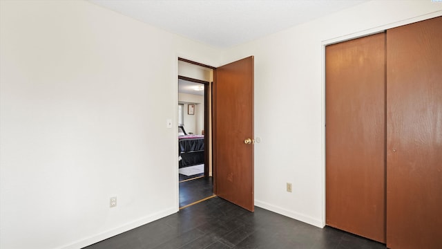 1707 S Fruitland St, Kennewick, WA 99337 - unfurnished bedroom featuring a closet and baseboards