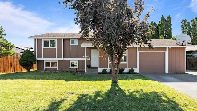 1707 S Fruitland St, Kennewick, WA 99337 - view of front facade with driveway, an attached garage, and a shingled roof