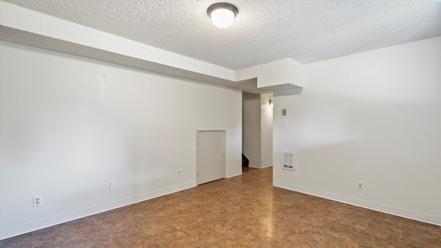 1707 S Fruitland St, Kennewick, WA 99337 - empty room with a textured ceiling and tile patterned floors
