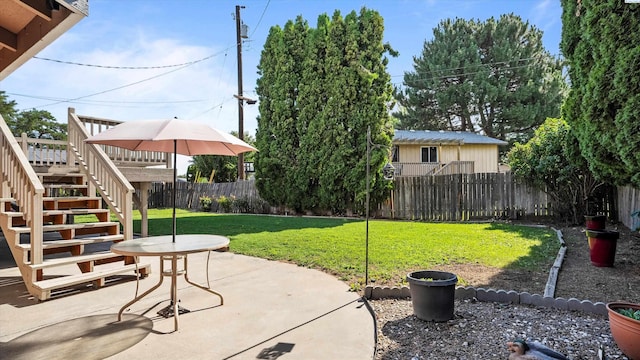 1707 S Fruitland St, Kennewick, WA 99337 - fenced backyard featuring stairs and a patio area