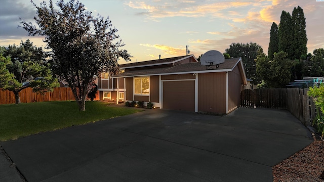 1707 S Fruitland St, Kennewick, WA 99337 - view of front facade with an attached garage, concrete driveway, and a shingled roof