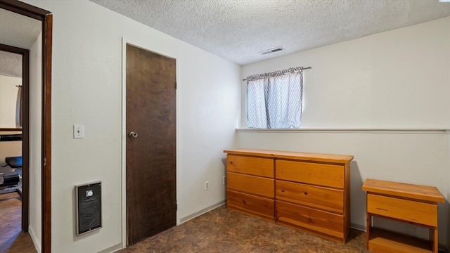 1707 S Fruitland St, Kennewick, WA 99337 - bedroom with a textured ceiling and heating unit