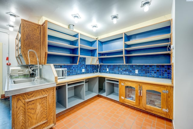 kitchen featuring sink and decorative backsplash