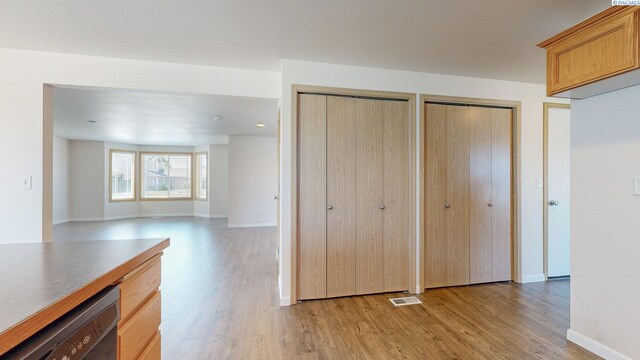 4613 Atlanta Ln, Pasco, WA 99301 - unfurnished living room featuring light wood finished floors and baseboards